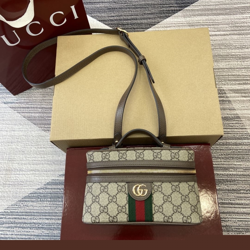 G*u*i cosmetic bags